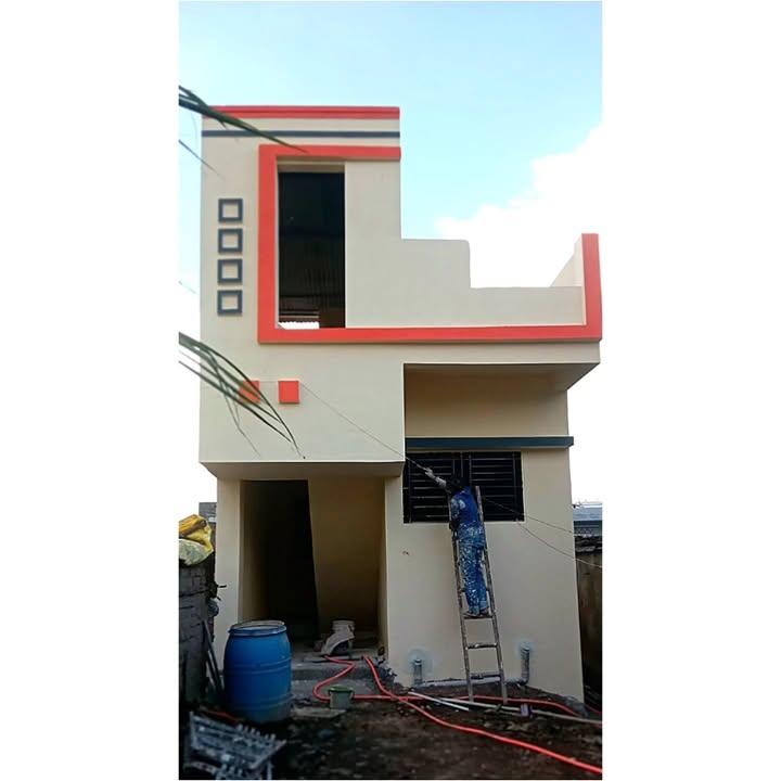 Worker finishing building elevation