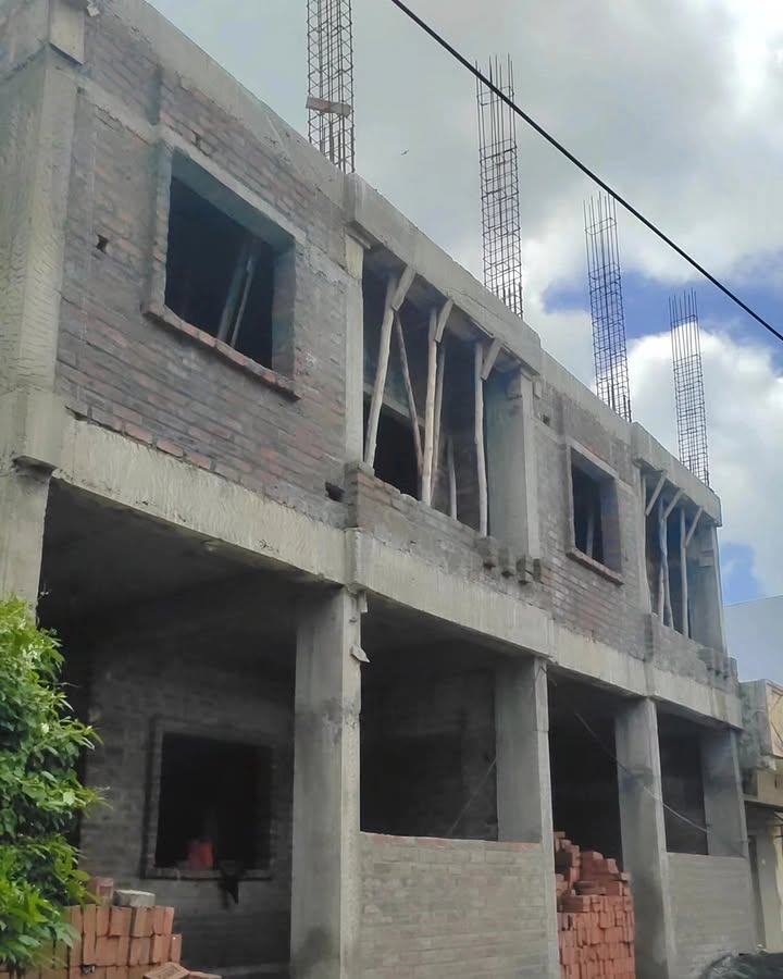 Construction site progress with workers